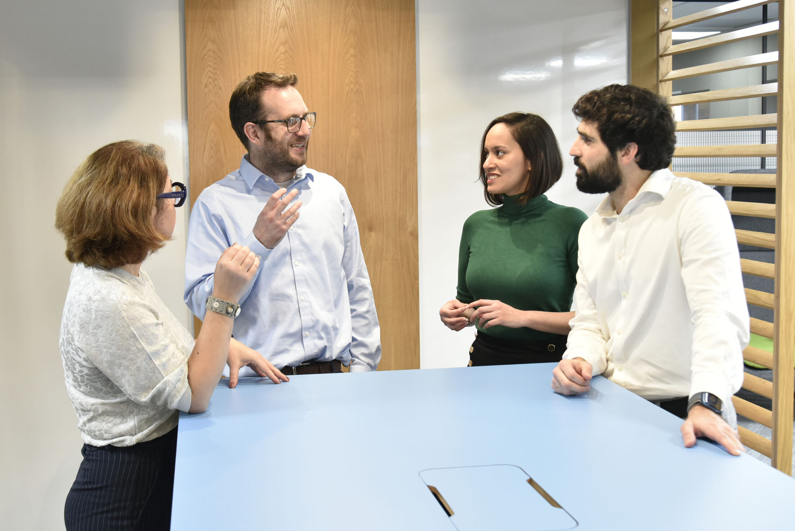 Consult Lhasa Lead Scientific Consultants in discussion around table